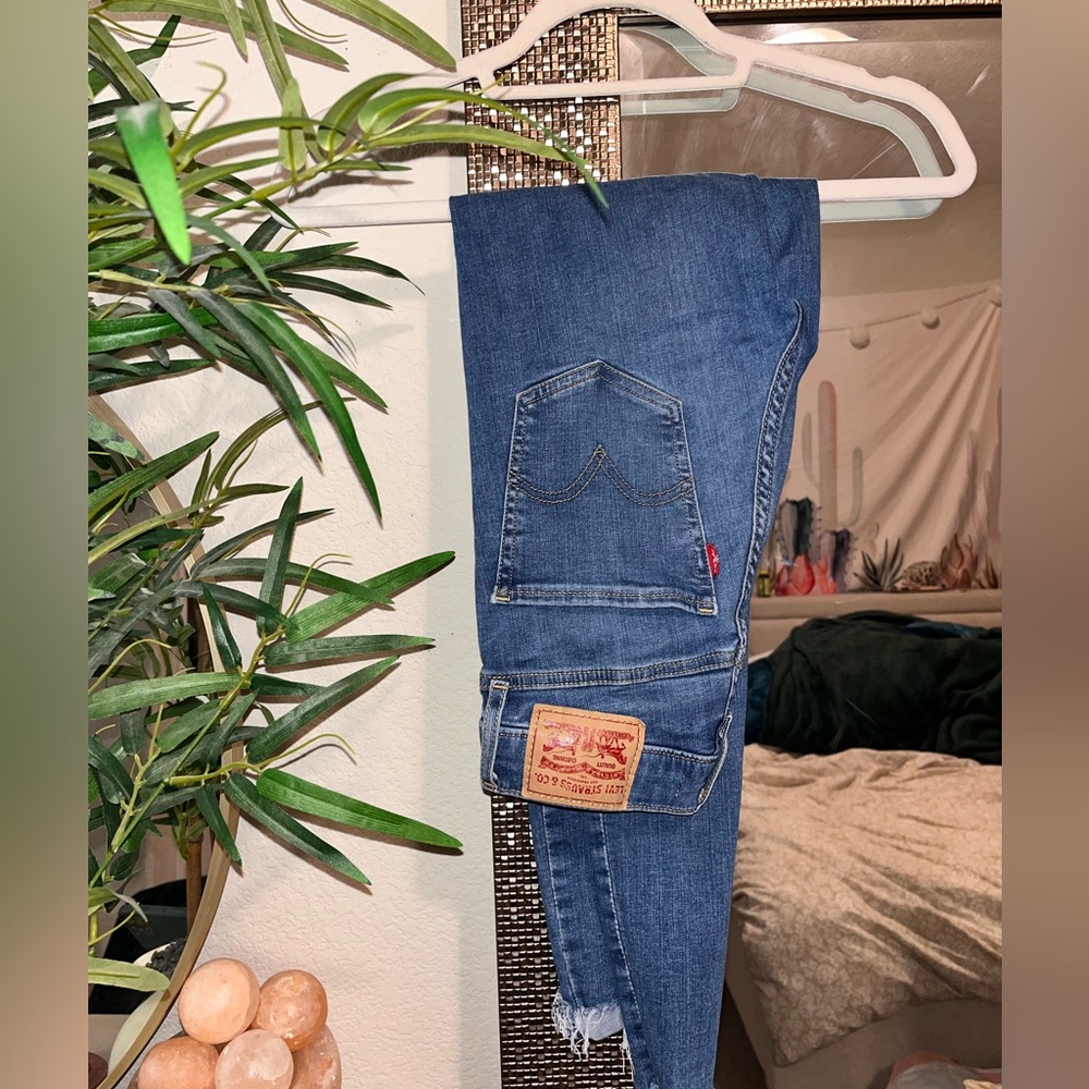 Levis jeans/ with rips in the knees